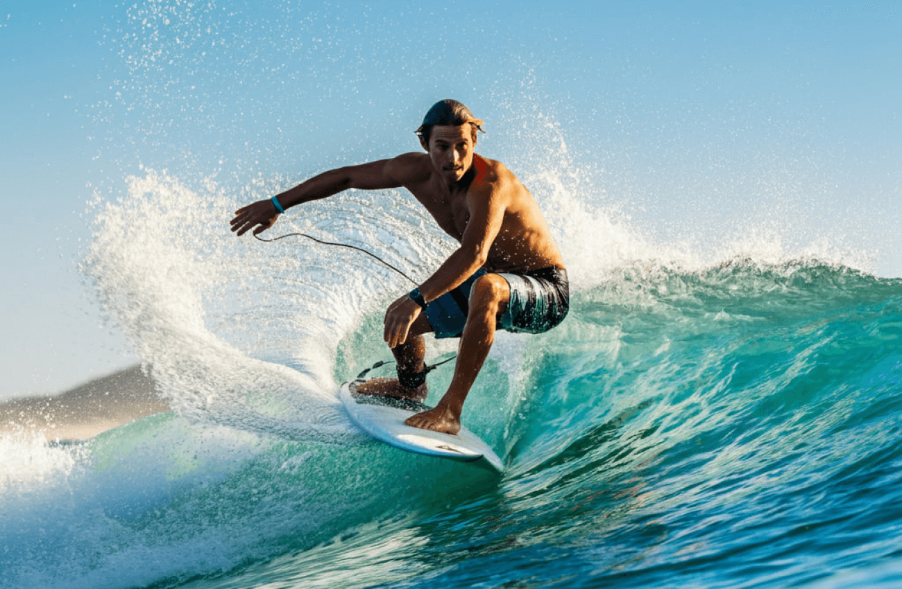 A guy surfing a wave at a popular surf beach in Phangan