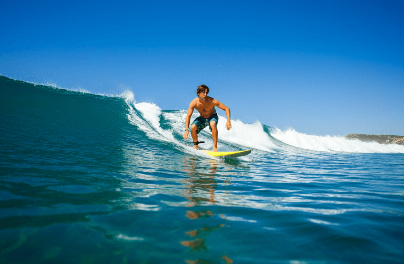 A man engaged in an exciting efoil surf session, gliding above the waves