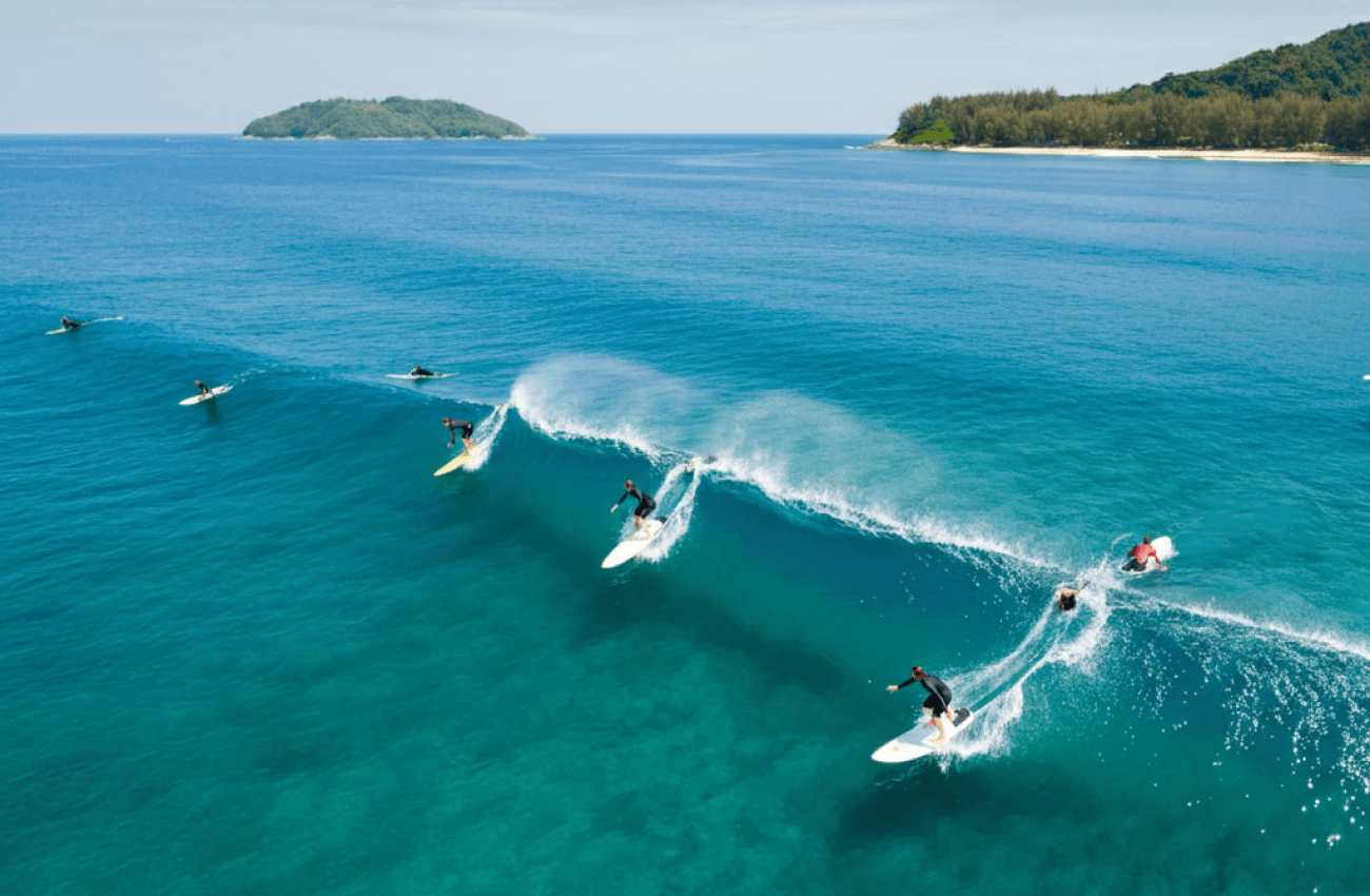 People learning basic techniques during one of their first surfing courses
